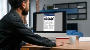 man looking at report on website