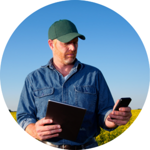 man working outside with cell phone in hand
