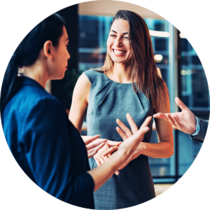 Smiling business woman talking business with a group