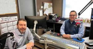 Willmar Lakes Area Chamber of Commerce President James Miller chatted with Managing Partner Joel Gratz, CPA at the KWLM Studios